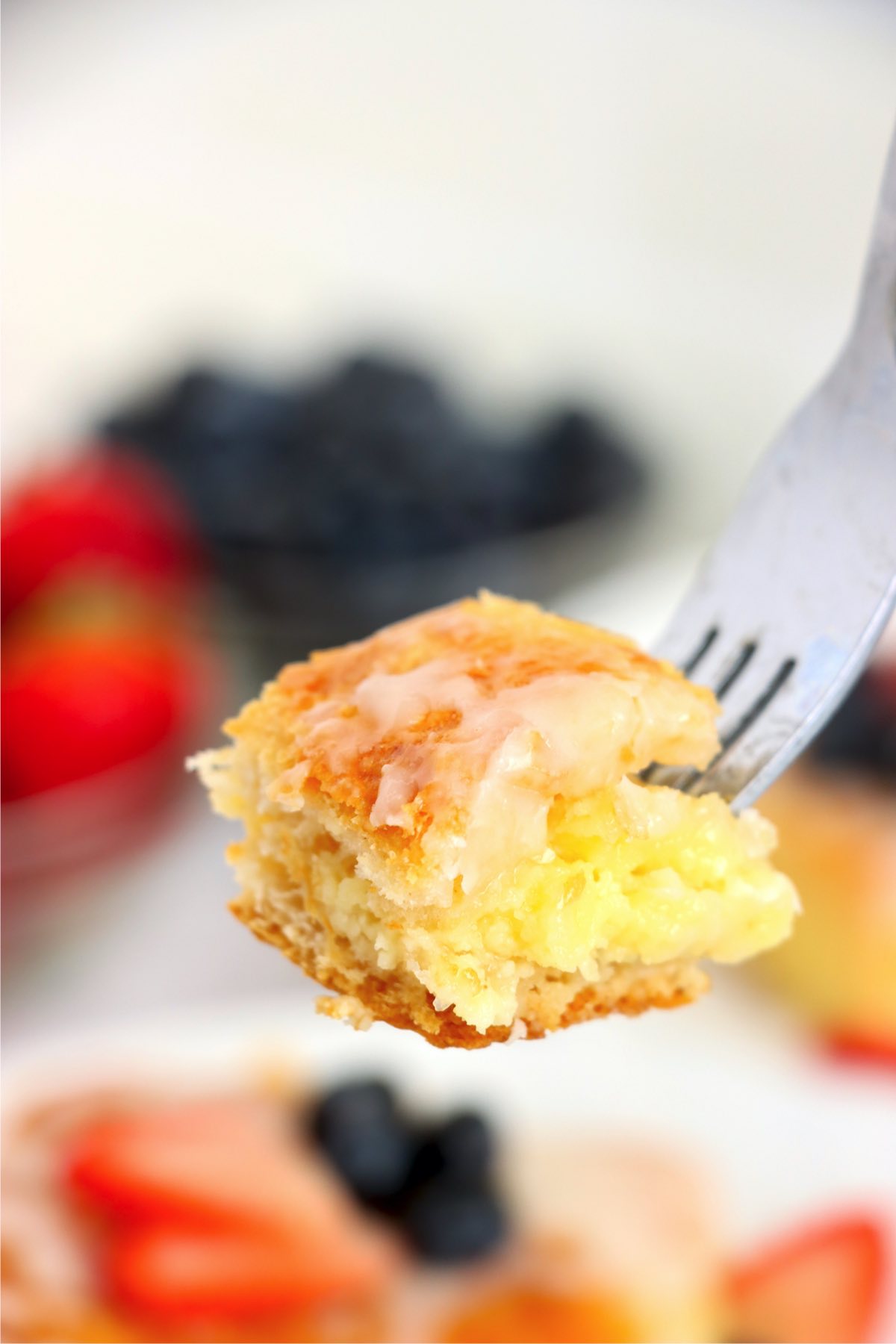 piece of cheese danish on end of a fork