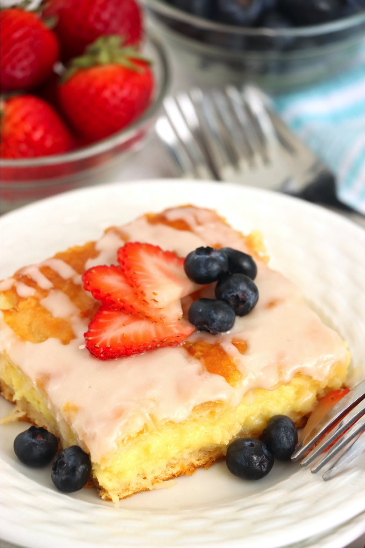 piece of danish with strawberries and blueberries