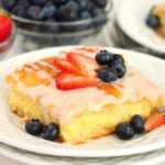 fruit topped cheese danish on a white plate