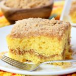 Easy Coffee Cake - A delicious and easy coffee cake made with a doctored-up yellow cake mix and filled and topped with crumbly, buttery cinnamon streusel!