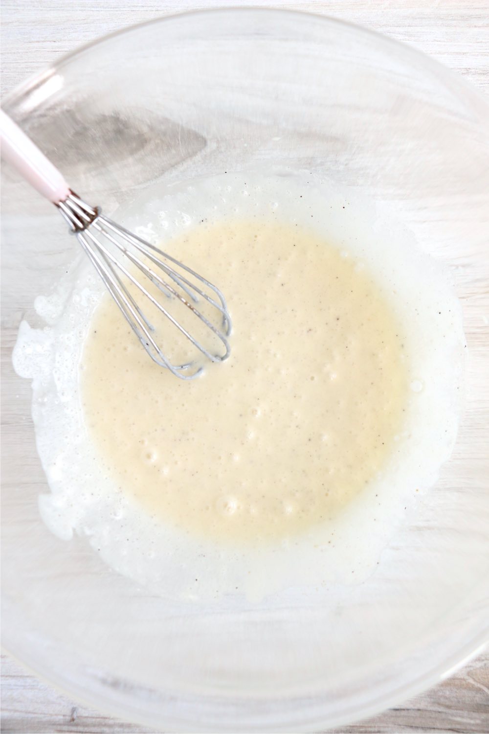 whisking together dressing for coleslaw