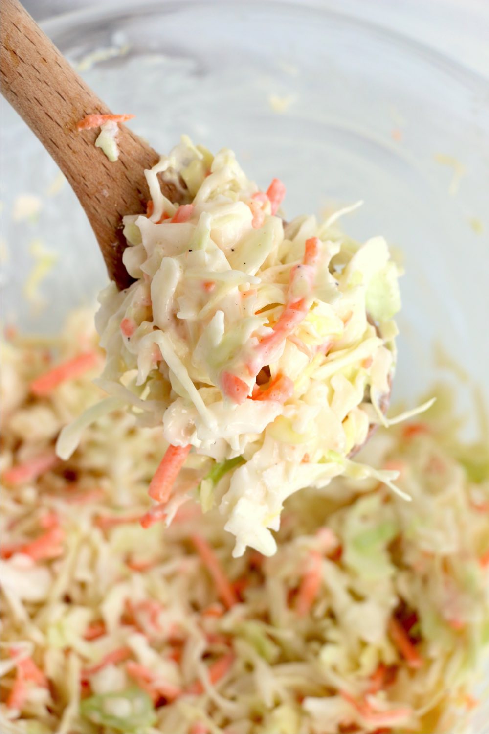 Wooden spoonful of coleslaw