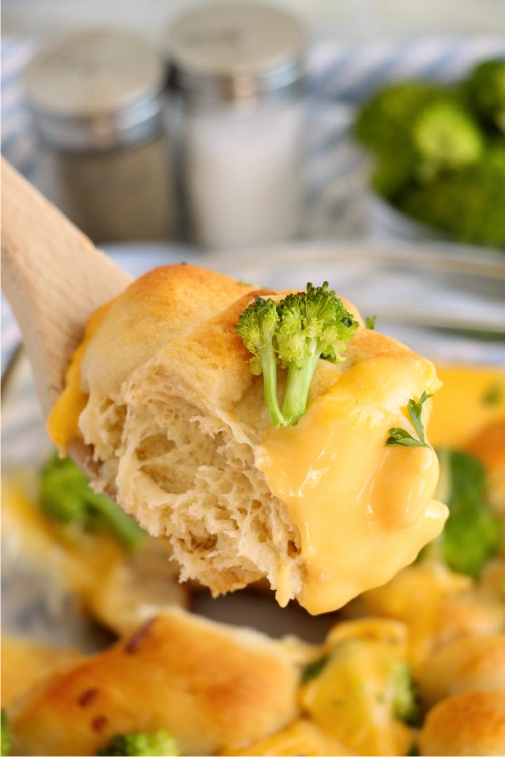 wooden spoon holding crescent roll chicken casserole