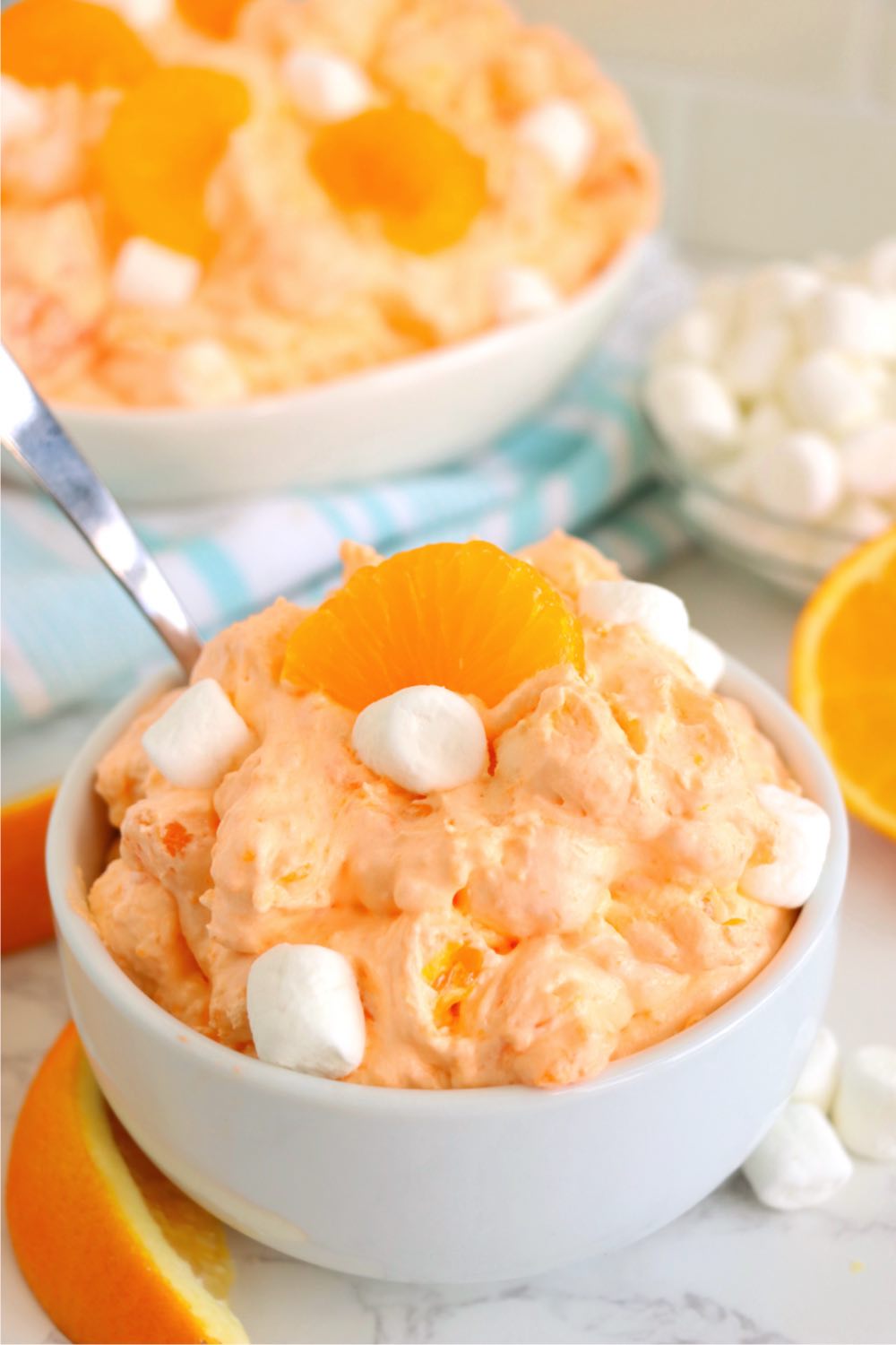 a small white bowl filled with orange fluff