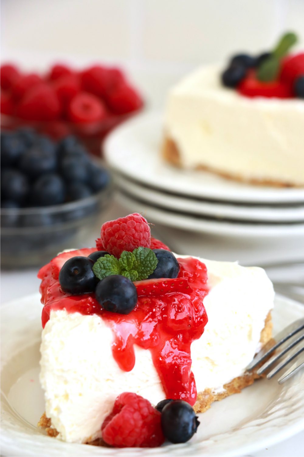 piece of cheesecake drizzled in strawberry sauce