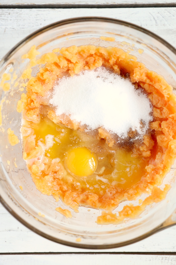 Easy Sweet Potato Casserole - An easy and delicious casserole that comes together with no scrubbing, boiling or baking the sweet potatoes! Topped with a sweet, salty and crunchy streusel, your guests will devour this simple and tasty side dish!