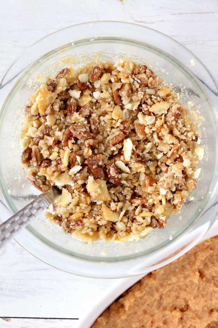 Easy Sweet Potato Casserole - An easy and delicious casserole that comes together with no scrubbing, boiling or baking the sweet potatoes! Topped with a sweet, salty and crunchy streusel, your guests will devour this simple and tasty side dish!