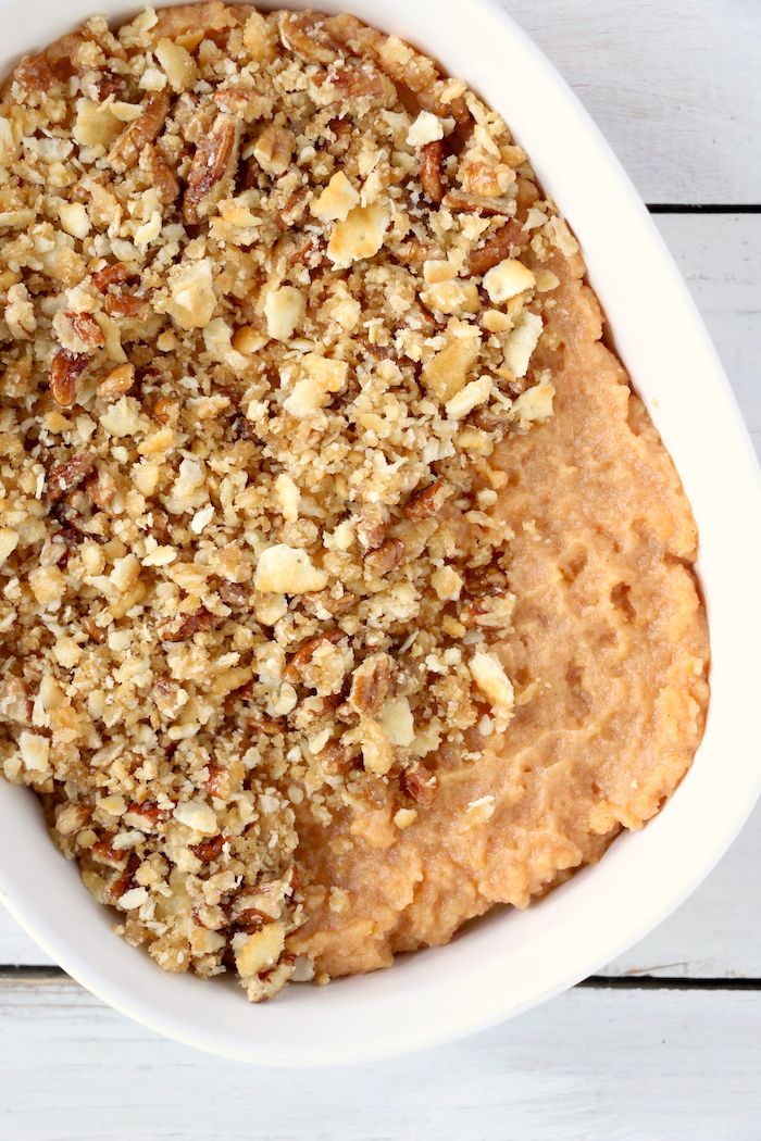 Easy Sweet Potato Casserole - An easy and delicious casserole that comes together with no scrubbing, boiling or baking the sweet potatoes! Topped with a sweet, salty and crunchy streusel, your guests will devour this simple and tasty side dish!