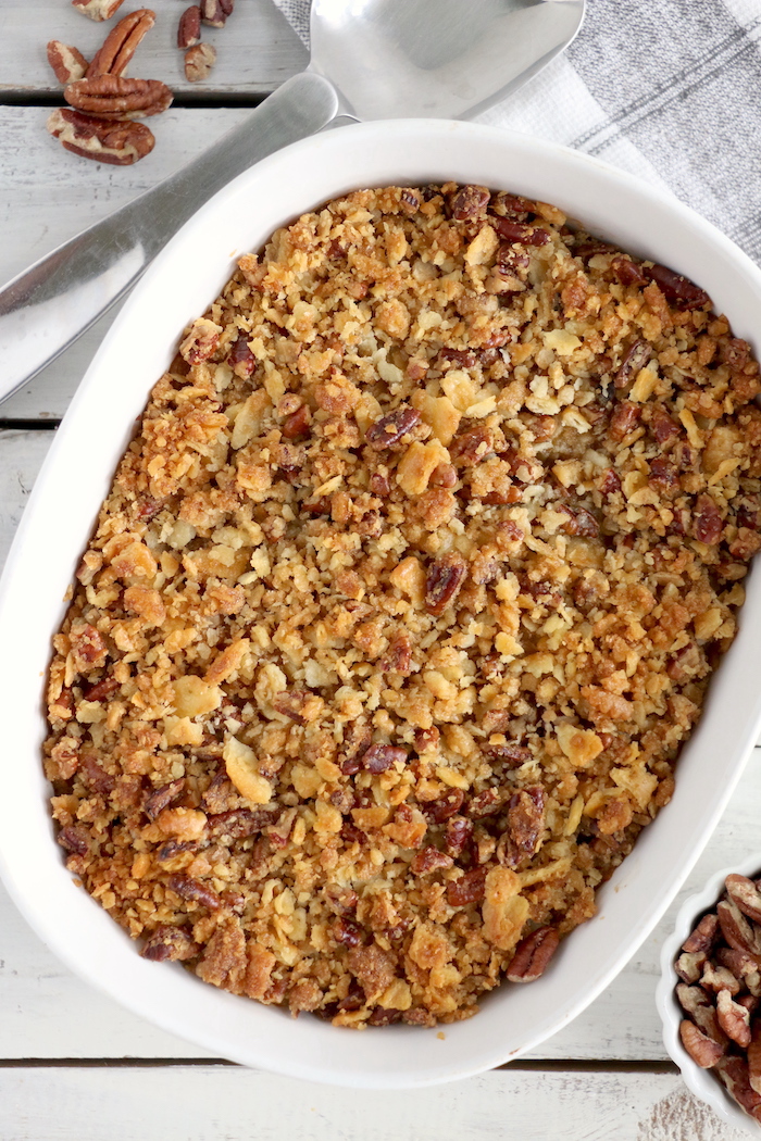 Easy Sweet Potato Casserole - An easy and delicious casserole that comes together with no scrubbing, boiling or baking the sweet potatoes! Topped with a sweet, salty and crunchy streusel, your guests will devour this simple and tasty side dish!