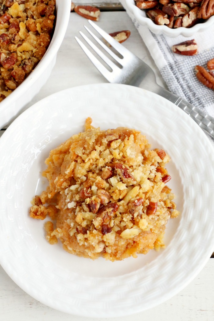 Easy Sweet Potato Casserole - An easy and delicious casserole that comes together with no scrubbing, boiling or baking the sweet potatoes! Topped with a sweet, salty and crunchy streusel, your guests will devour this simple and tasty side dish!