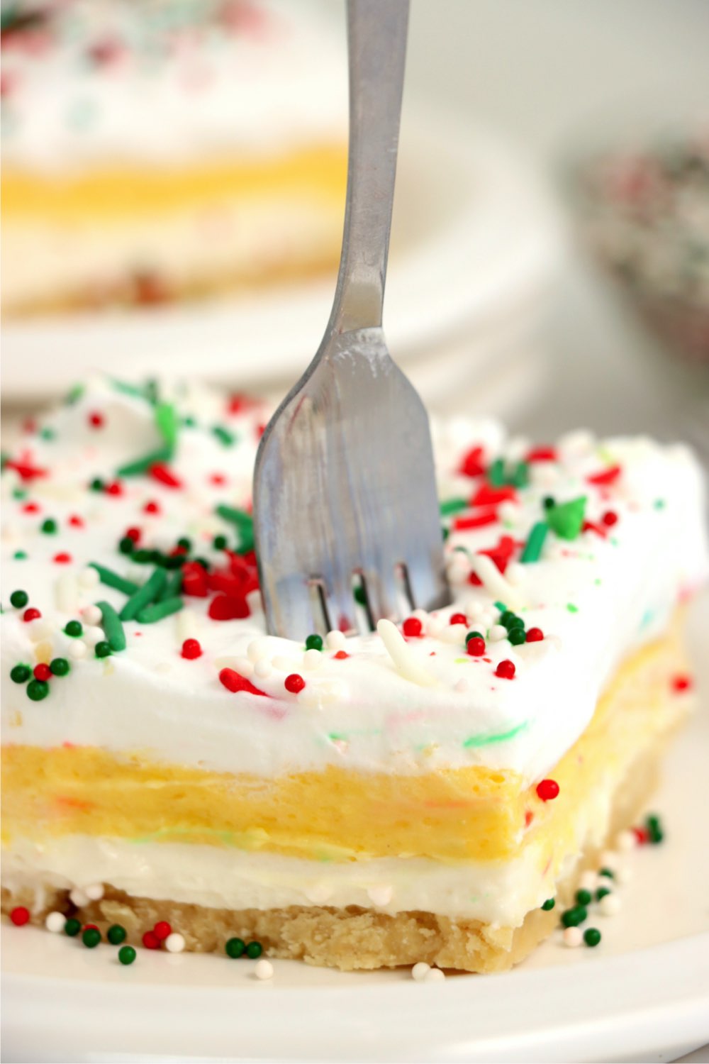 fork digging into pudding layer dessert
