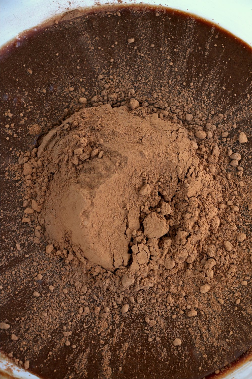 Adding cocoa powder to cake ingredients
