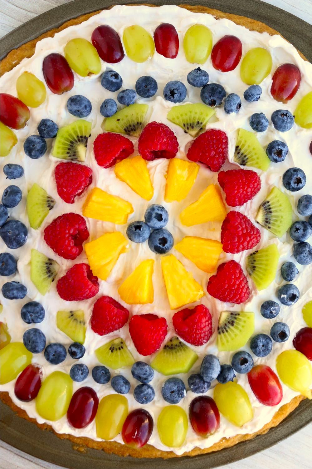 Fresh fruit neatly arranged on a fruit pizza