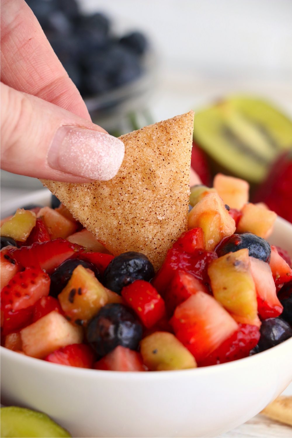 dipping a chip in salsa