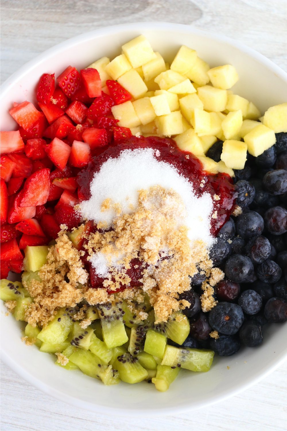 fruit in bowl with sugar and jam