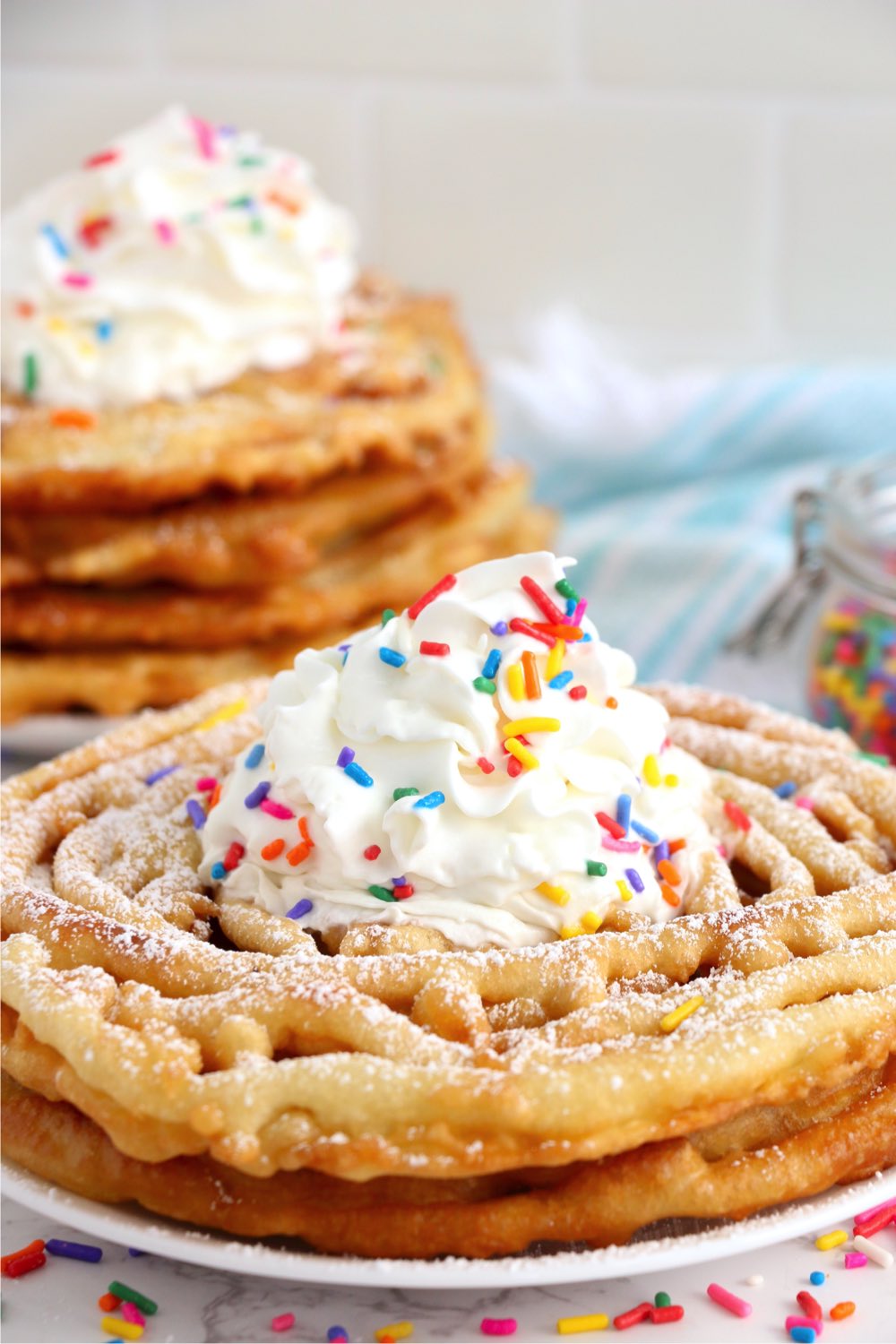 Funnel cake stack on a white plate