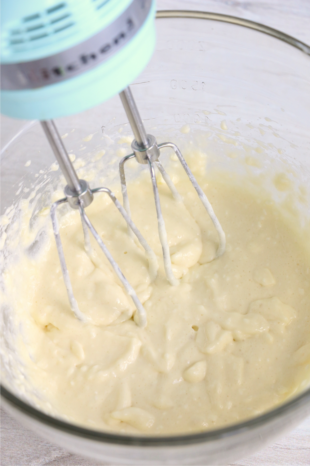 mixing together cream cheese layer for brownies