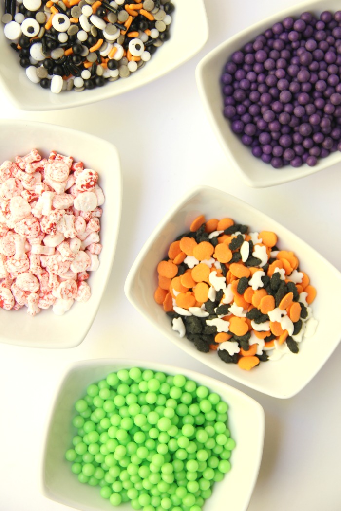 Witch Cauldron Mug Cake - A chocolate mug cake made in a ceramic witch cauldron with halloween-themed frosting and sprinkles!