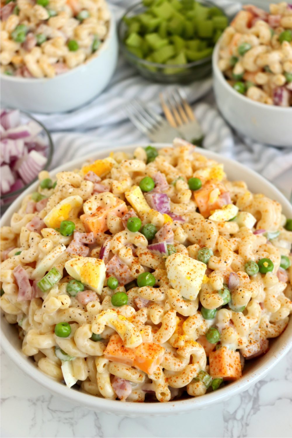white bowl filled with ham macaroni salad