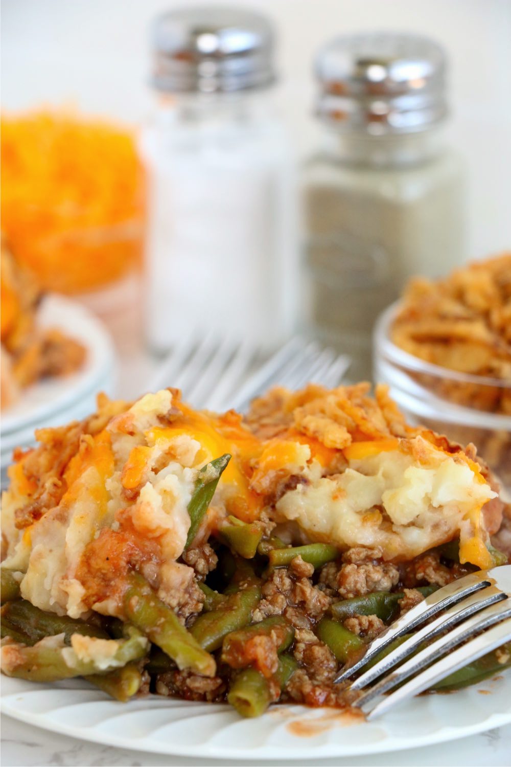 fork laying on plate filled with casserole