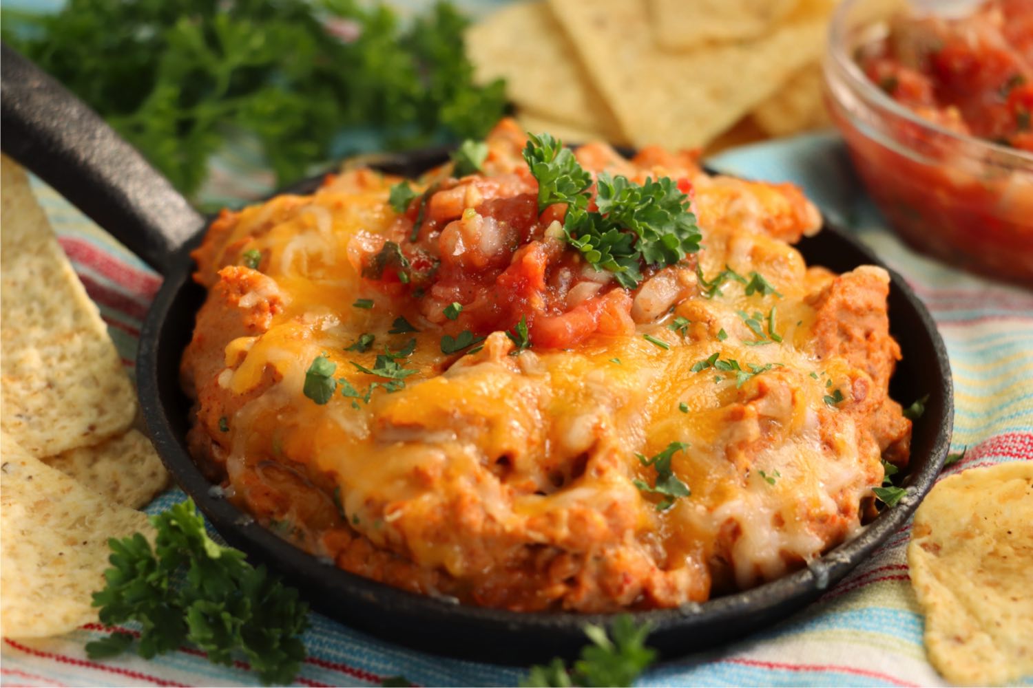warm bean dip in a dish with cheese