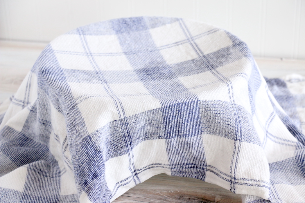 bowl of dough covered with a dish towel