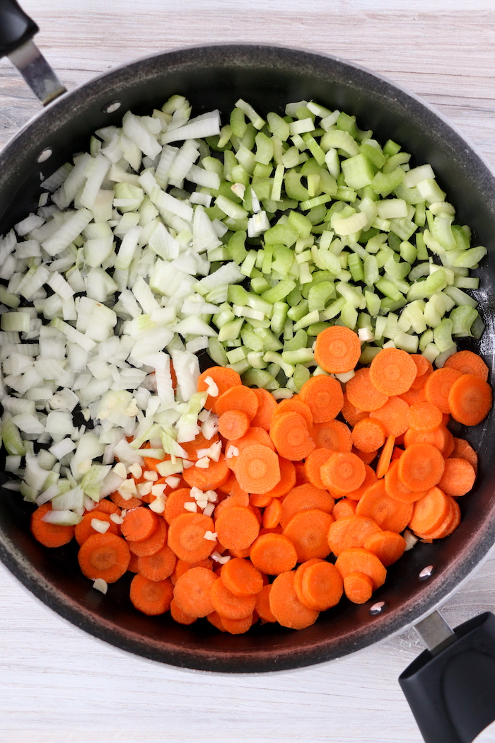 Carrots, onions and celery in soup pot