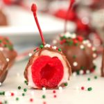 plate of cordial cherries with the center of one exposed
