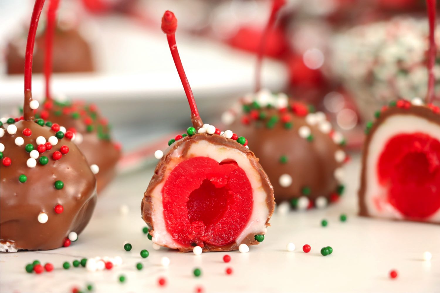 plate of cordial cherries with the center of one exposed