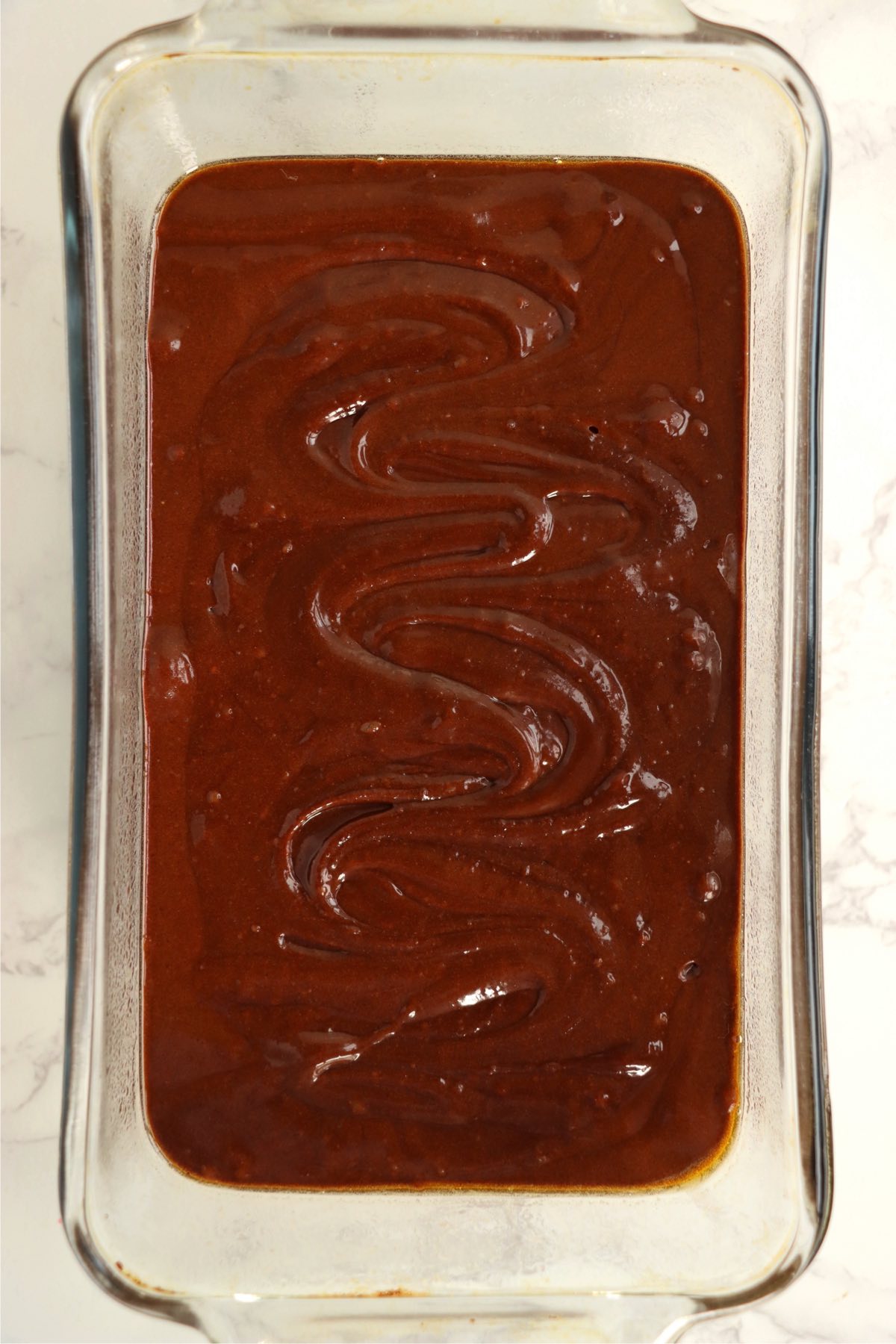 Brownie batter in a loaf pan