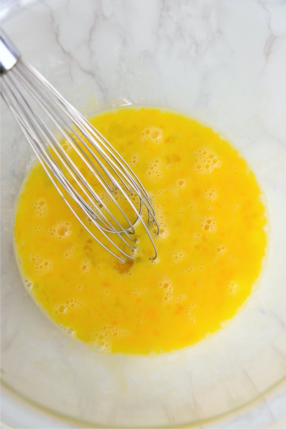 whisking eggs in bowl
