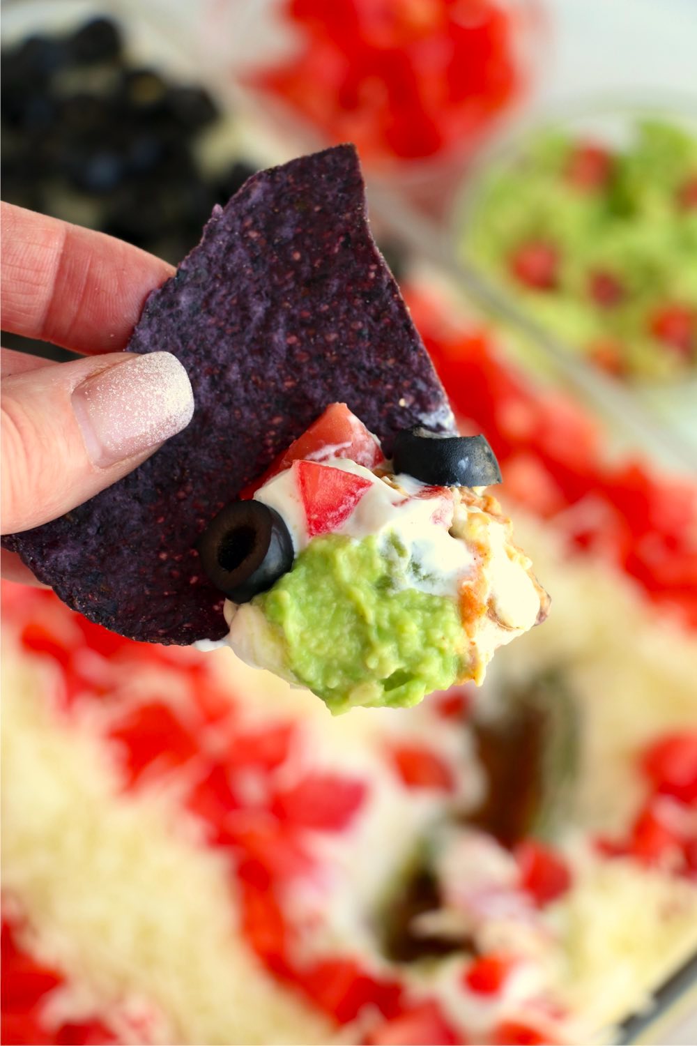 Tortilla chip dipped in taco dip