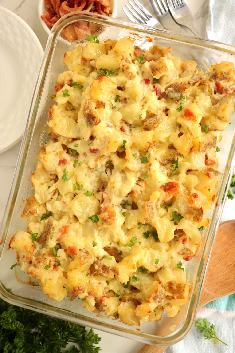 glass pan of loaded potato casserole