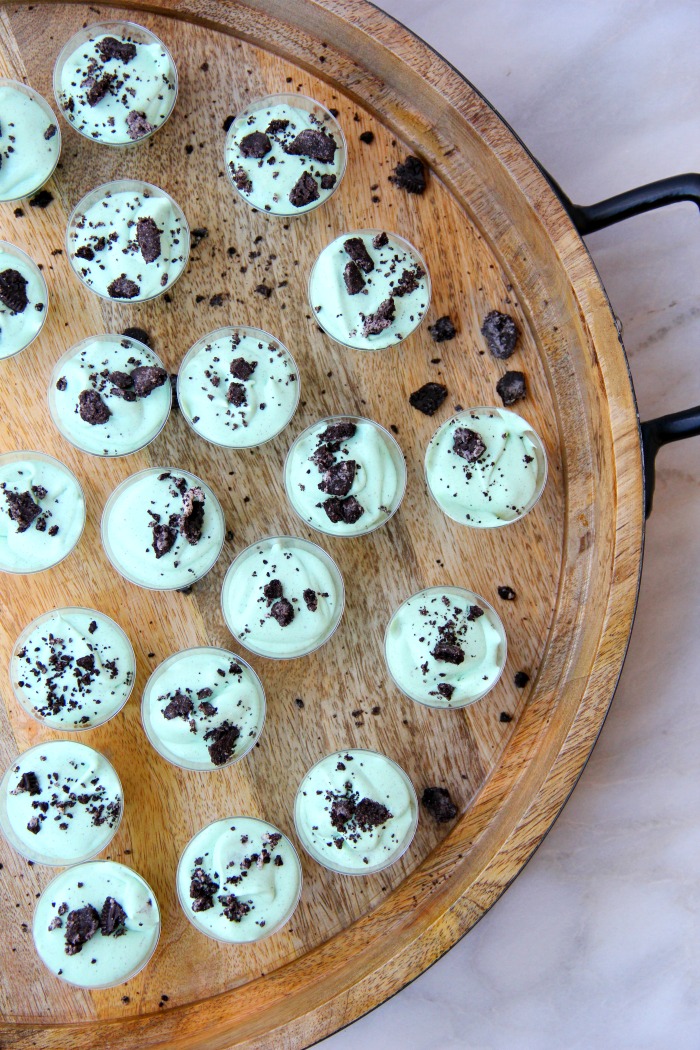 Mint Oreo Pudding Shots - Perfect for the holidays, St. Patrick's Day or just whenever you're in the mood for a little taste of mint and chocolate. These taste just like an adult version of a Thin Mint Girl Scout Cookie!