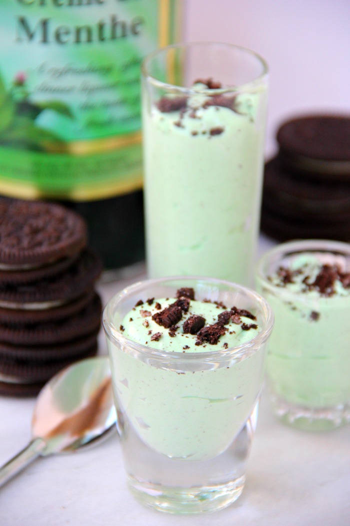 Mint Oreo Pudding Shots - Perfect for the holidays, St. Patrick's Day or just whenever you're in the mood for a little taste of mint and chocolate. These taste just like an adult version of a Thin Mint Girl Scout Cookie!