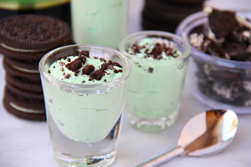 Mint Oreo Pudding Shots - Perfect for the holidays, St. Patrick's Day or just whenever you're in the mood for a little taste of mint and chocolate. These taste just like an adult version of a Thin Mint Girl Scout Cookie!