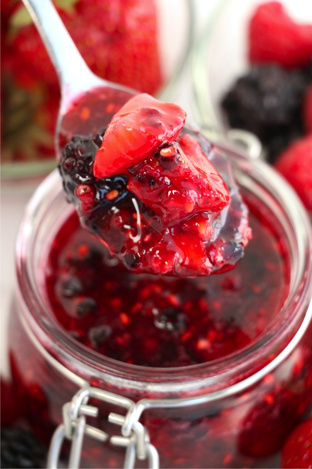 scooping a spoonful of jam