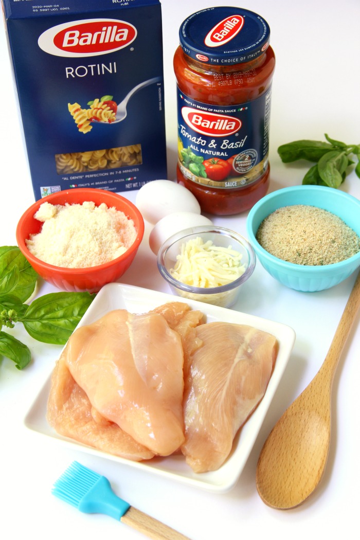 Mozzarella Basil Chicken -a delicious twist on traditional chicken parmesan. The chicken cutlets are breaded and baked, creating delicious and moist chicken to serve over pasta and sauce.