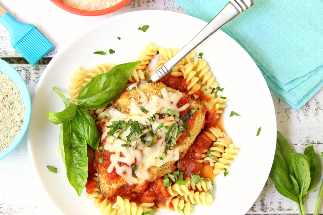 Mozzarella Basil Chicken -a delicious twist on traditional chicken parmesan. The chicken cutlets are breaded and baked, creating delicious and moist chicken to serve over pasta and sauce.