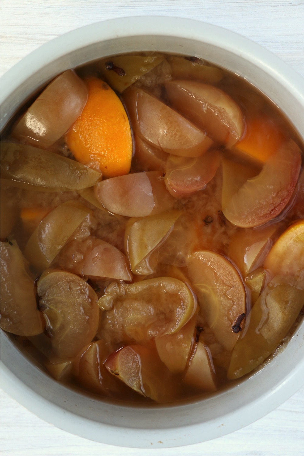 Ninja Foodi cooking pot filled with cooked fresh fruit