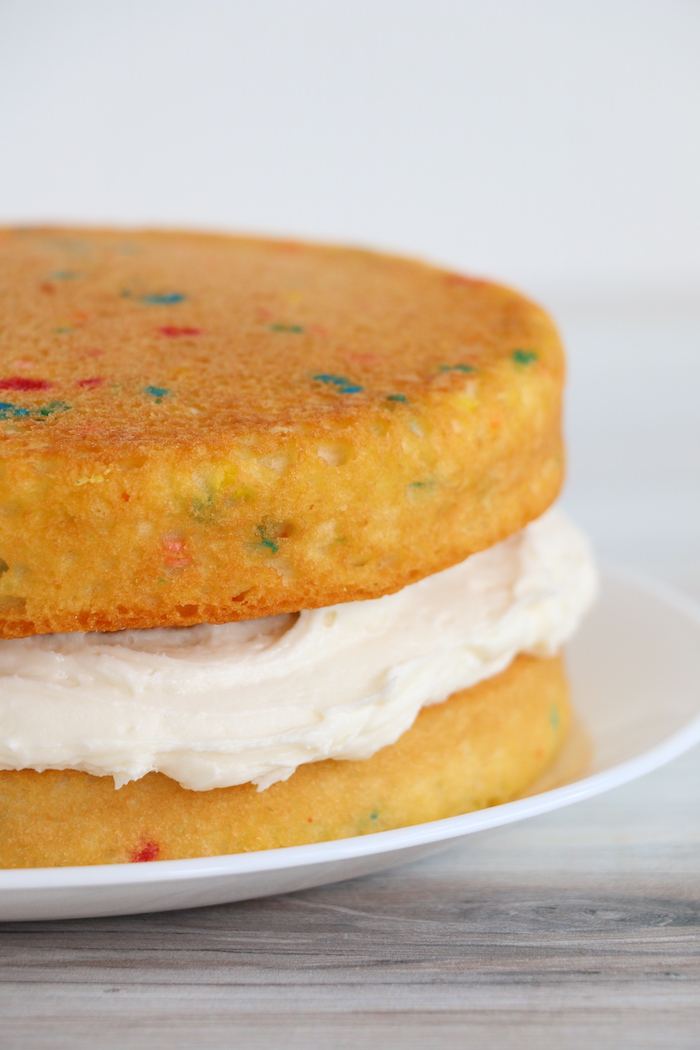 layer cake with frosting in the middle