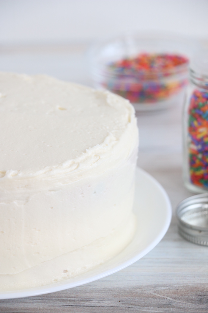 frosted layer cake on white plate