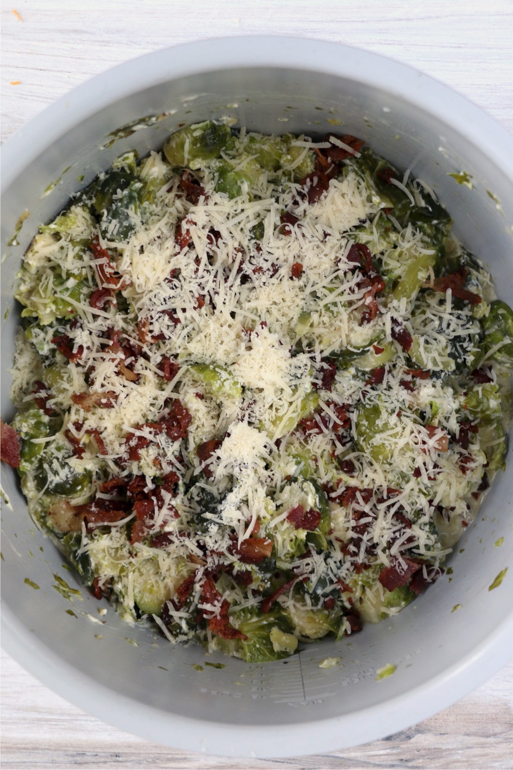 parmesan cheese and bacon on top of Brussels Sprouts