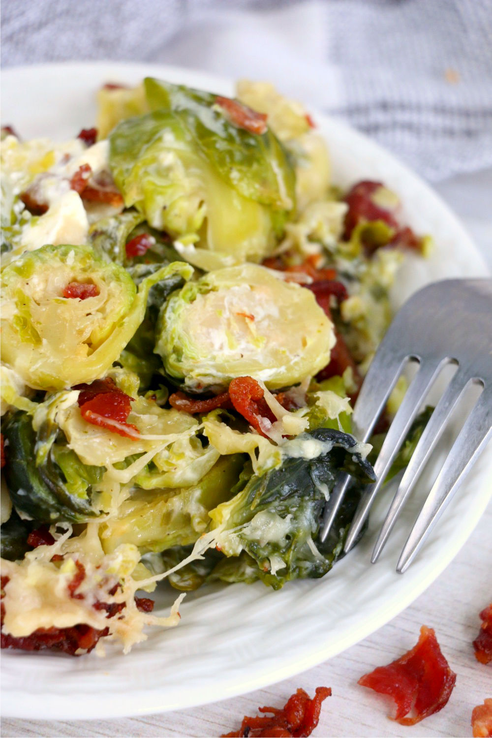 Plate of Brussels sprouts with fork upside down