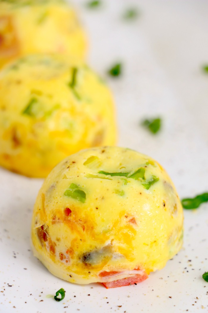 Egg bites lined up on a plate