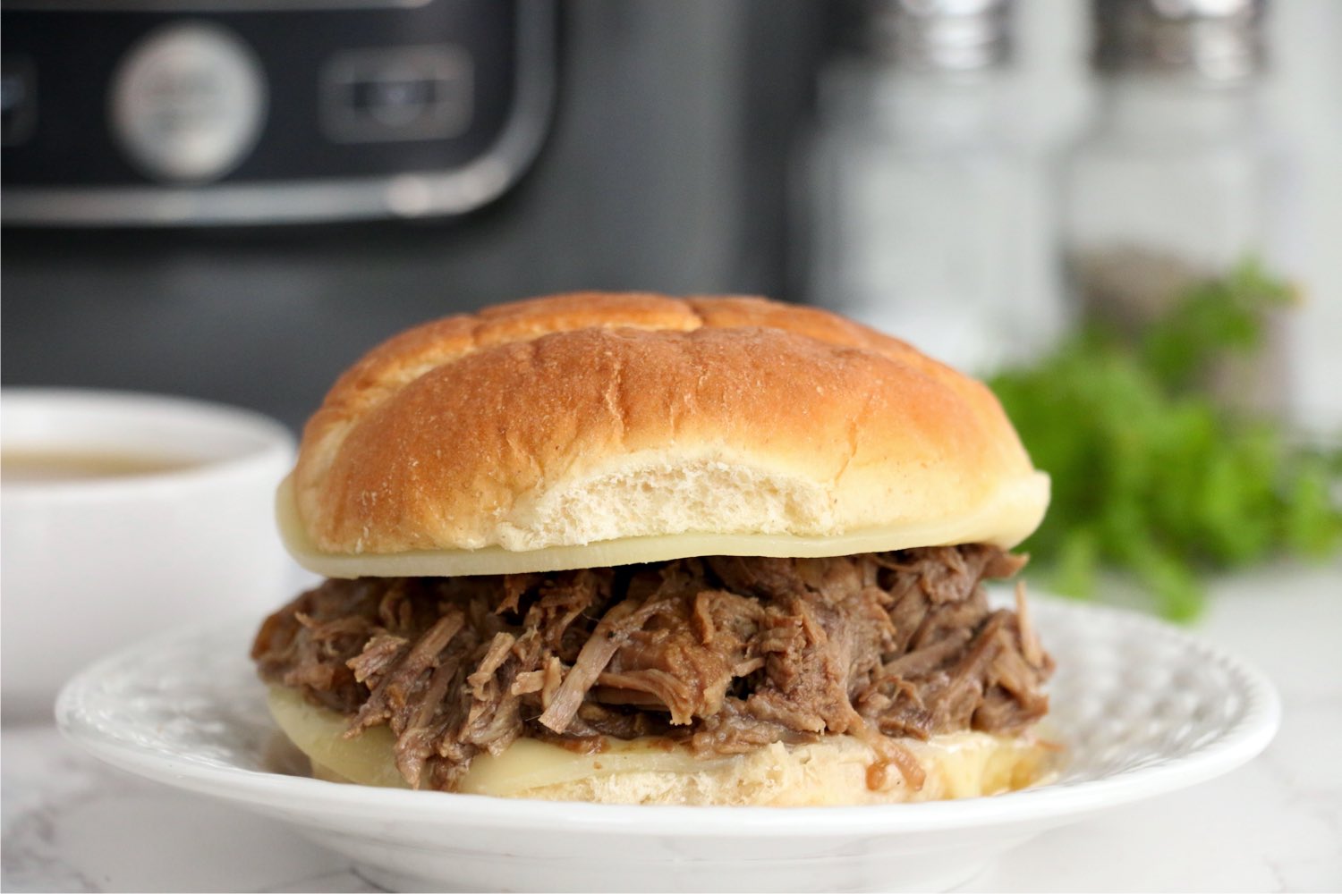 French dip sandwich on burger bun