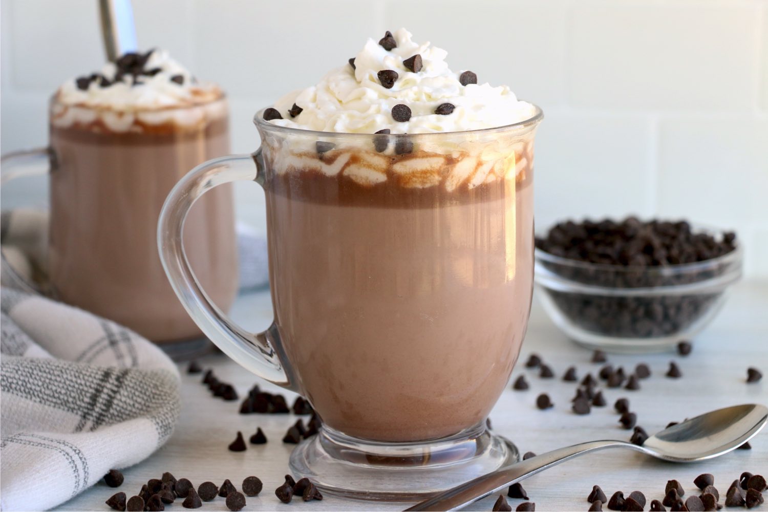 two glass mugs of hot chocolate