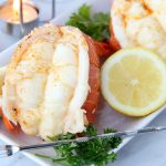 up close shot of lobster tails on plate