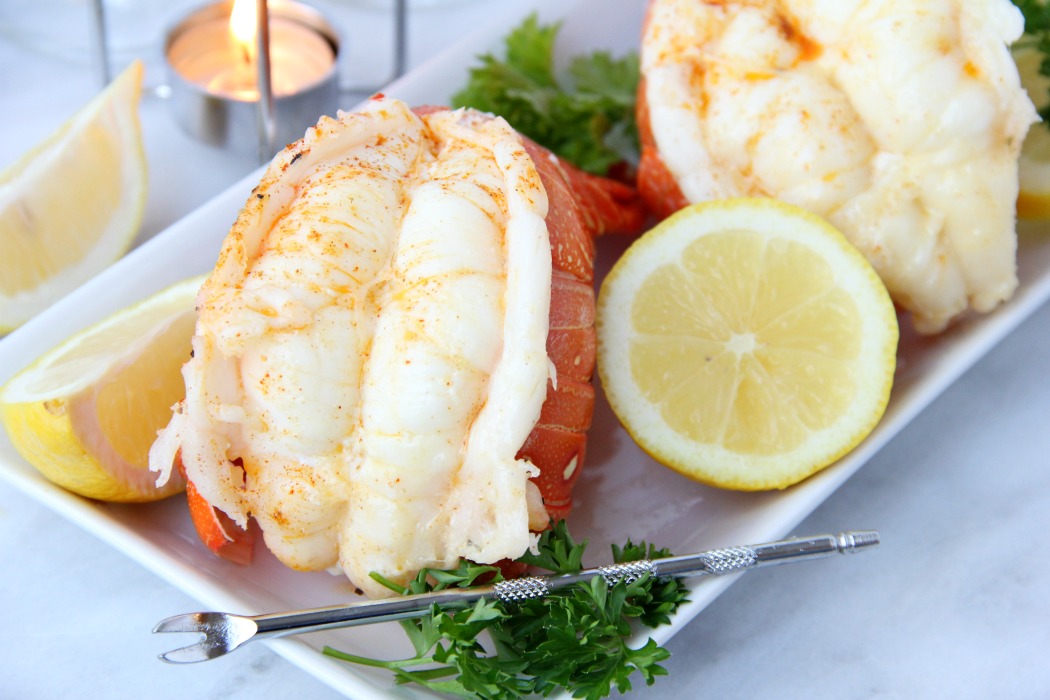 up close shot of lobster tails on plate