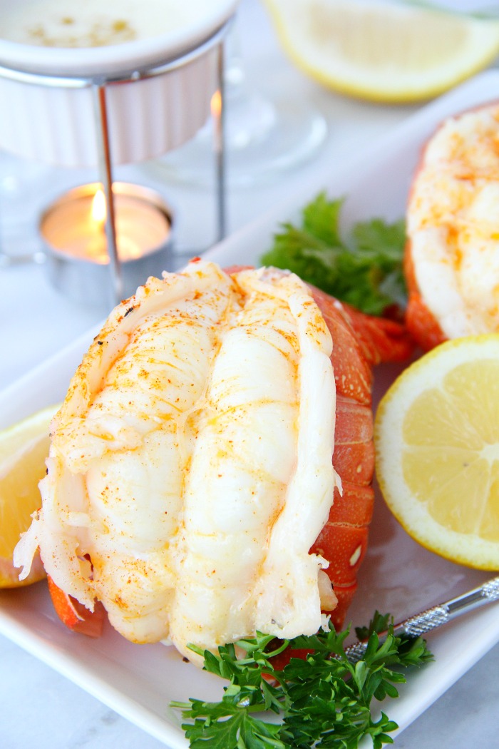 close up of lobster tail with lemon